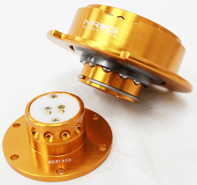 This is the quick release disconnected. The bottom piece bolts to the short hub adaptor and stays in your FTO always, the lock goes on here when your steering wheel is released. The top piece bolts to your after market steering wheel and comes out of your FTO with the steering wheel