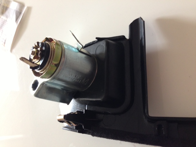 Old cigarette surround/cigarette charger attached to stereo surround - back