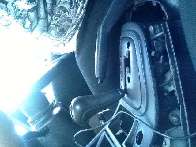 It surrounds the gears and goes up the sides of the stereo